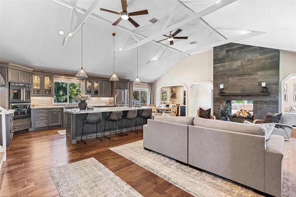 Fireplace, Interior, Kitchen, Living room, Pendant Lights, Recessed Lighting, Stainless Steel Appliances, Wood Texture Flooring