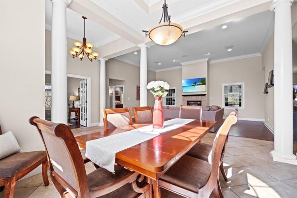 Chandelier, Dining room, Fireplace, Interior, Living room, Pendant Lights, Recessed Lighting, Wood Texture Flooring
