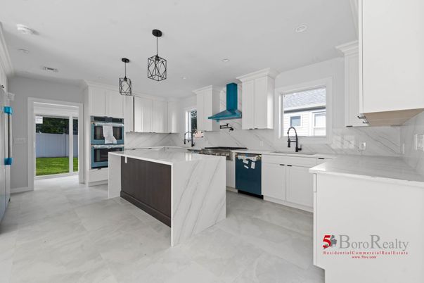 Interior, Kitchen, Marble Walls, Pendant Lights, Recessed Lighting, Stainless Steel Appliances