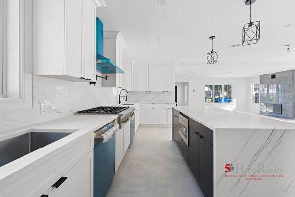 Interior, Kitchen, Marble Walls, Pendant Lights, Recessed Lighting, Stainless Steel Appliances