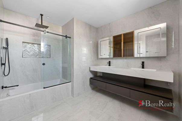 Bathroom, Dual Sink Vanities, Glass Shower, Interior, Marble, Marble Walls, Recessed Lighting
