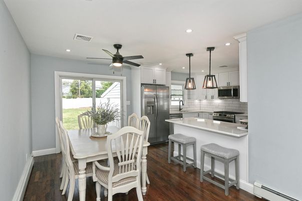 Dining room, Interior, Kitchen, Pendant Lights, Recessed Lighting, Stainless Steel Appliances, Wood Texture Flooring