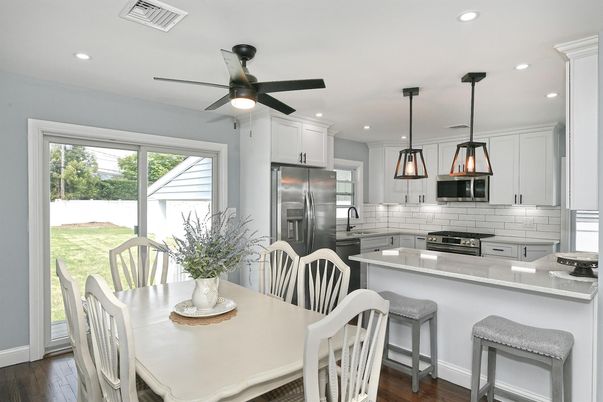 Dining room, Interior, Kitchen, Pendant Lights, Recessed Lighting, Stainless Steel Appliances, Wood Texture Flooring