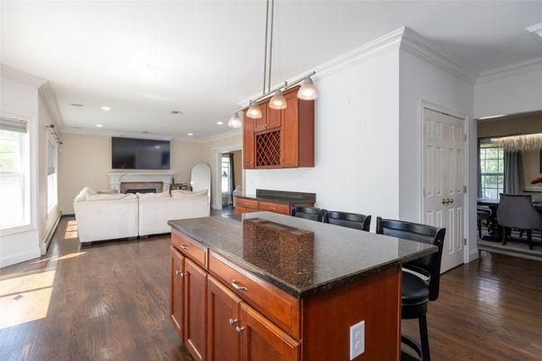 Dining room, Fireplace, Interior, Living room, Pendant Lights, Recessed Lighting, Wood Texture Flooring