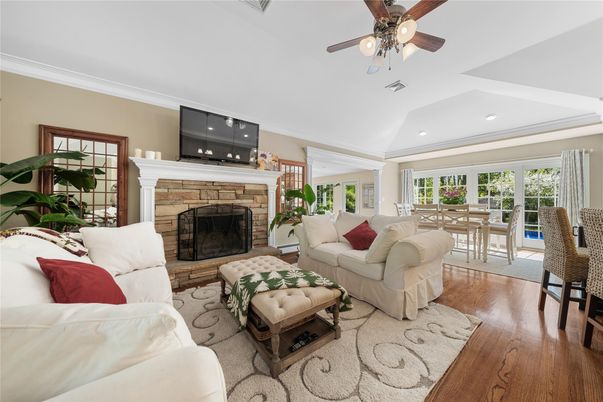 Dining room, Fireplace, Interior, Living room, Recessed Lighting, Wood Texture Flooring