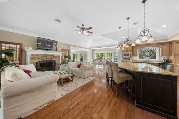 Chandelier, Dining room, Fireplace, Interior, Kitchen, Living room, Pendant Lights, Recessed Lighting, Wood Texture Flooring