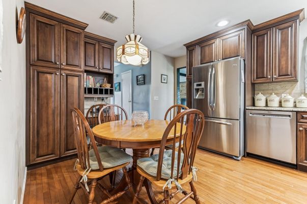 Dining room, Interior, Kitchen, Pendant Lights, Recessed Lighting, Stainless Steel Appliances, Wood Texture Flooring