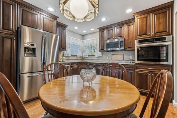Dining room, Interior, Kitchen, Recessed Lighting, Stainless Steel Appliances, Wood Texture Flooring