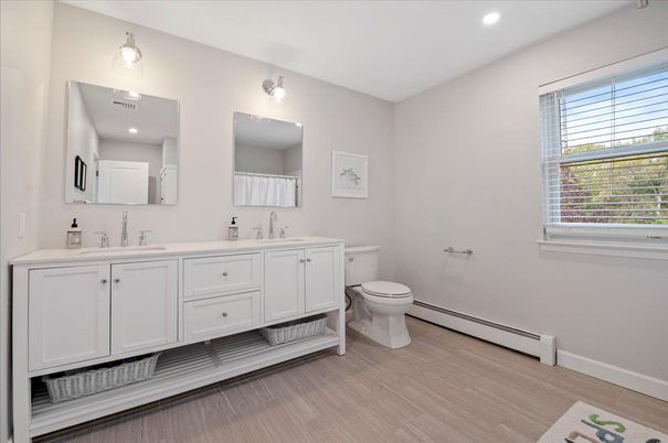 Bathroom, Dual Sink Vanities, Interior, Recessed Lighting, Wood Texture Flooring