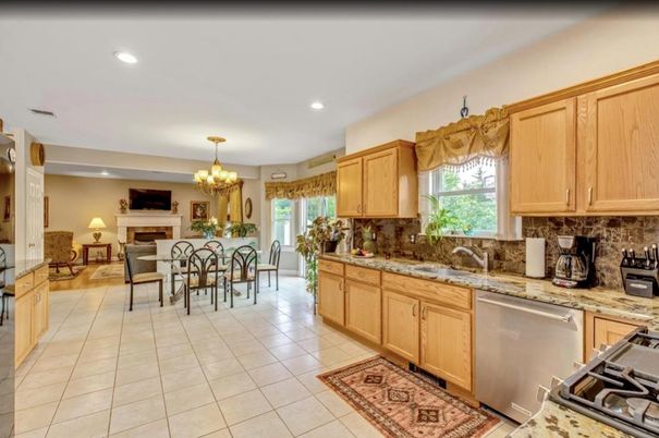 Chandelier, Dining room, Fireplace, Interior, Kitchen, Living room, Recessed Lighting, Stainless Steel Appliances
