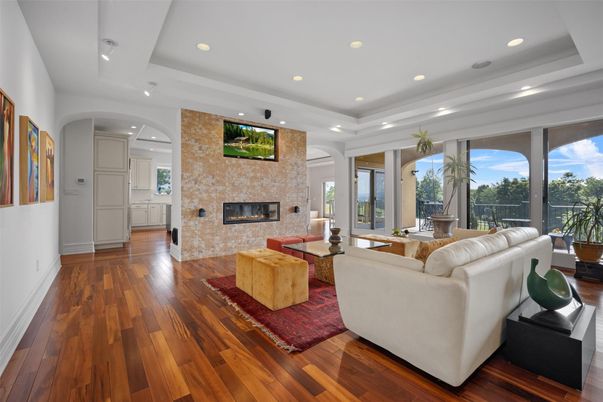 Fireplace, Interior, Living room, Recessed Lighting, Stone Walls, Wood Texture Flooring
