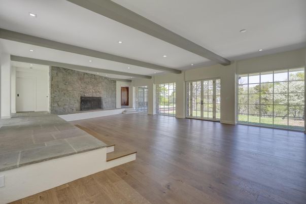 Empty room, Fireplace, Interior, Recessed Lighting, Stone Walls, Wooden Beams, Wood Texture Flooring