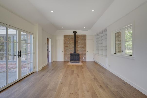 Empty room, Fireplace, Interior, Recessed Lighting, Stone Walls, Wood Texture Flooring