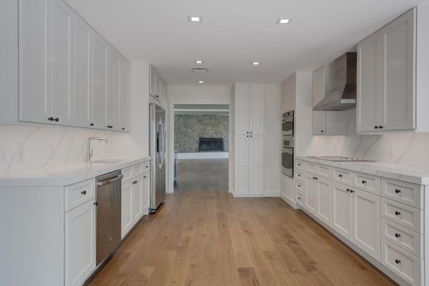 Fireplace, Interior, Kitchen, Recessed Lighting, Stainless Steel Appliances, Wood Texture Flooring