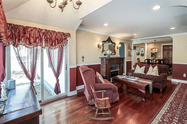 Chandelier, Dining room, Fireplace, Interior, Living room, Pendant Lights, Recessed Lighting, Wood Texture Flooring