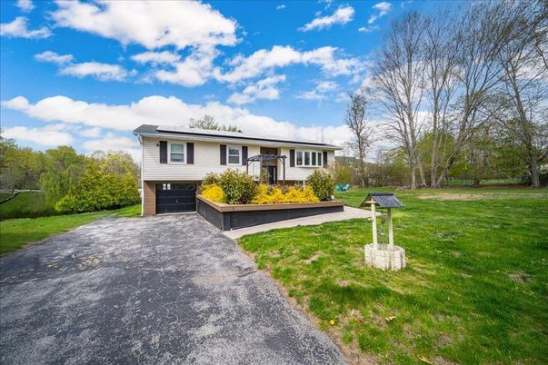 Attached, Backyard, Exterior, Facade, Solar Panels, Raised Ranch