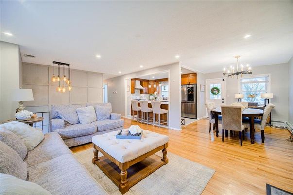 Chandelier, Dining room, Interior, Kitchen, Living room, Pendant Lights, Recessed Lighting, Stainless Steel Appliances, Wood Texture Flooring