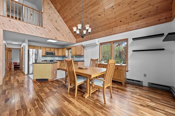 Chandelier, Dining room, Interior, Kitchen, Pendant Lights, Stainless Steel Appliances, Wooden Ceilings, Wood Texture Flooring
