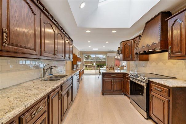 Dining room, Interior, Kitchen, Recessed Lighting, Stainless Steel Appliances, Wood Texture Flooring