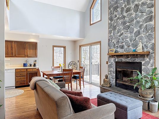 Dining room, Fireplace, Interior, Kitchen, Living room, Recessed Lighting, Stone Walls, Wood Texture Flooring