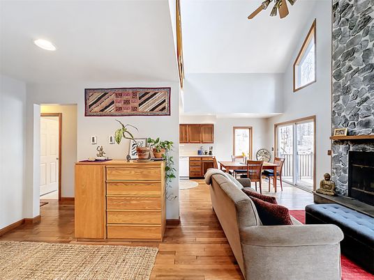 Dining room, Fireplace, Interior, Living room, Recessed Lighting, Wood Texture Flooring