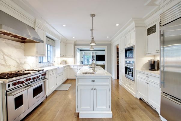 Interior, Kitchen, Marble Walls, Pendant Lights, Recessed Lighting, Stainless Steel Appliances, Wood Texture Flooring