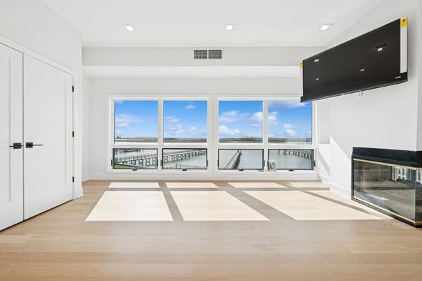 Empty room, Fireplace, Interior, Recessed Lighting, Water, Wood Texture Flooring