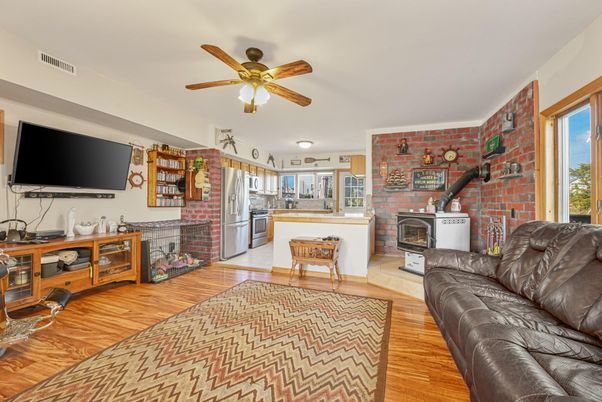 Fireplace, Interior, Kitchen, Living room, Stainless Steel Appliances, Stone Walls, Wood Texture Flooring