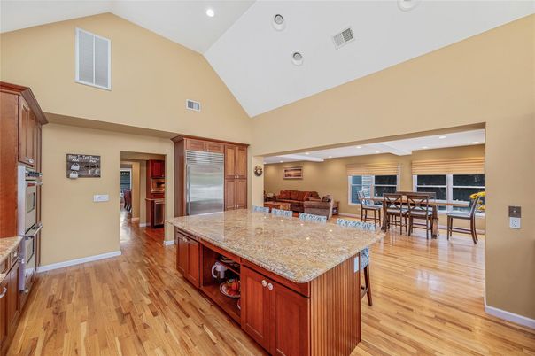 Dining room, Interior, Kitchen, Recessed Lighting, Stainless Steel Appliances, Wood Texture Flooring