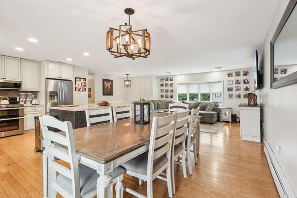 Chandelier, Dining room, Interior, Kitchen, Living room, Pendant Lights, Recessed Lighting, Stainless Steel Appliances, Wood Texture Flooring