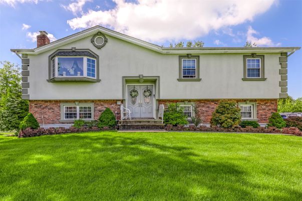 Exterior, Facade, Brick Facade, Raised Ranch