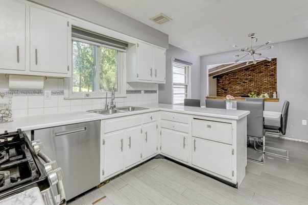 Dining room, Interior, Kitchen, Pendant Lights, Stainless Steel Appliances, Stone Walls, Wood Texture Flooring
