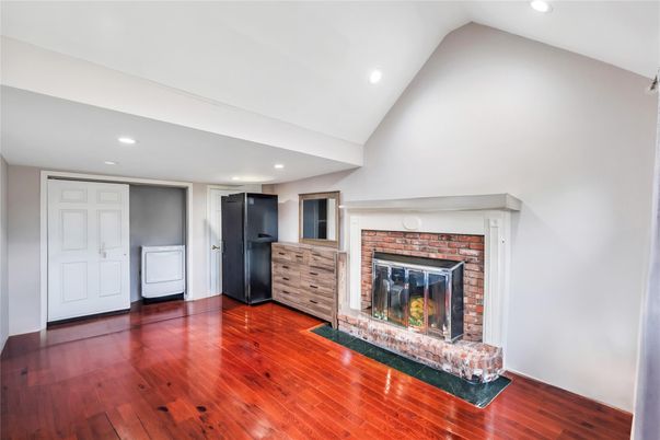 Fireplace, Interior, Recessed Lighting, Washer, Wood Texture Flooring