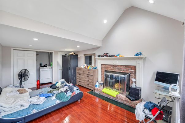 Bedroom, Fireplace, Interior, Recessed Lighting, Wood Texture Flooring