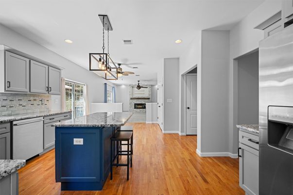Fireplace, Interior, Kitchen, Pendant Lights, Recessed Lighting, Stainless Steel Appliances, Wood Texture Flooring