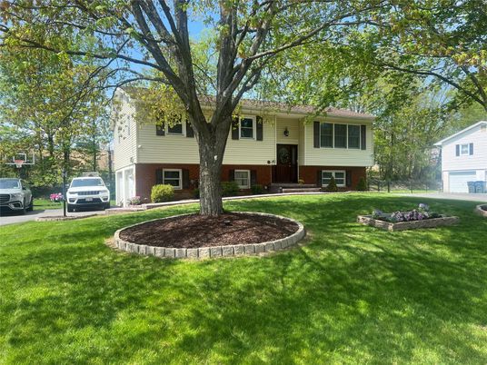 Exterior, Facade, Brick Facade, Raised Ranch