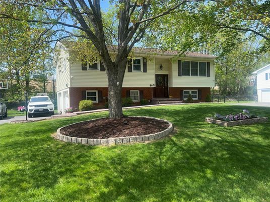 Attached, Backyard, Exterior, Facade, Brick Facade, Raised Ranch
