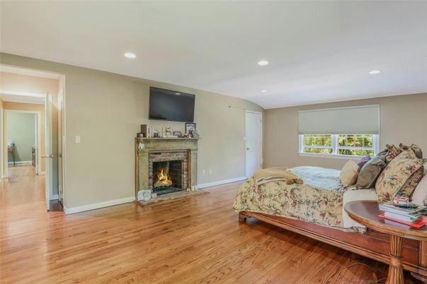 Bedroom, Fireplace, Interior, Recessed Lighting, Wood Texture Flooring