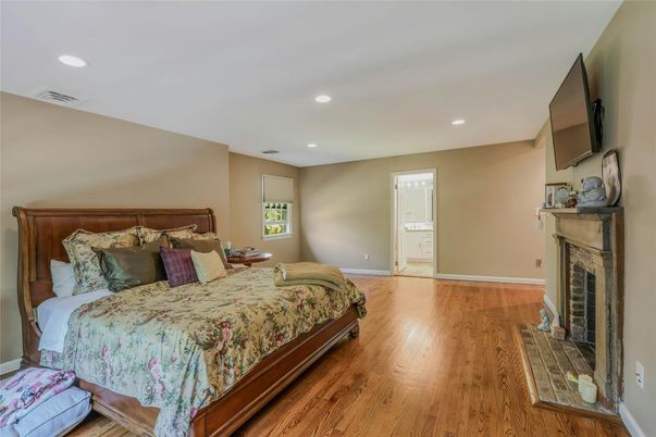 Bedroom, Fireplace, Interior, Recessed Lighting, Wood Texture Flooring