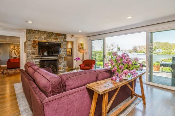 Fireplace, Interior, Living room, Recessed Lighting, Stone Walls, Water, Wood Texture Flooring