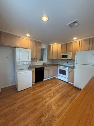 Interior, Kitchen, Recessed Lighting, Washer, Wood Texture Flooring