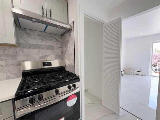 Interior, Kitchen, Marble, Marble Walls, Recessed Lighting, Stainless Steel Appliances