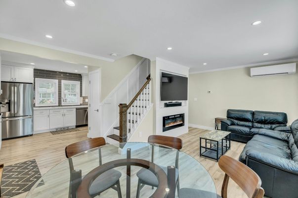 Dining room, Fireplace, Interior, Kitchen, Living room, Recessed Lighting, Stainless Steel Appliances, Wood Texture Flooring