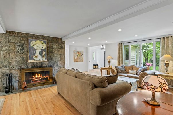 Fireplace, Interior, Living room, Recessed Lighting, Stone Walls, Wood Texture Flooring