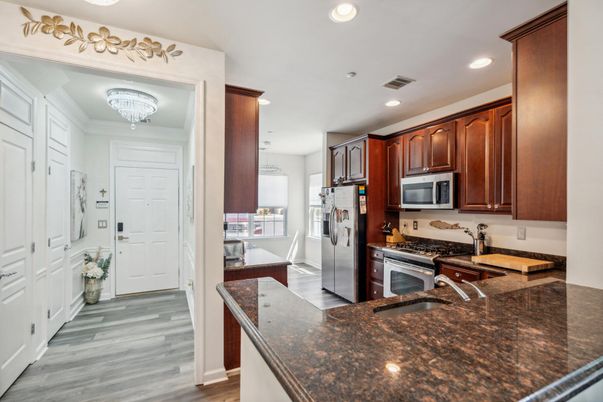 Chandelier, Interior, Kitchen, Recessed Lighting, Stainless Steel Appliances, Wood Texture Flooring