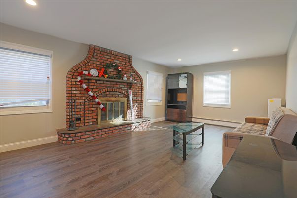Fireplace, Interior, Recessed Lighting, Stone Walls, Wood Texture Flooring
