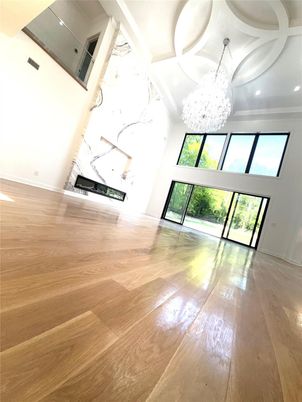 Chandelier, Fireplace, Interior, Marble Walls, Recessed Lighting, Wood Texture Flooring