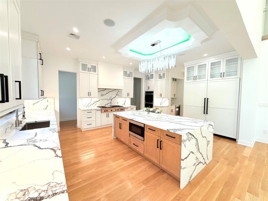 Chandelier, Interior, Kitchen, Marble Walls, Recessed Lighting, Stainless Steel Appliances, Wood Texture Flooring