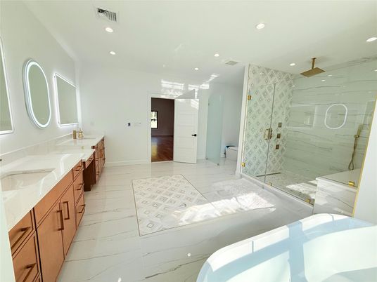 Bathroom, Dual Sink Vanities, Glass Shower, Interior, Marble, Marble Walls, Recessed Lighting