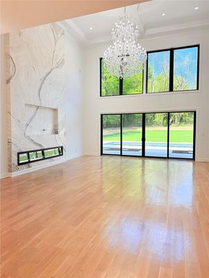 Empty room, Fireplace, Interior, Marble Walls, Recessed Lighting, Wood Texture Flooring